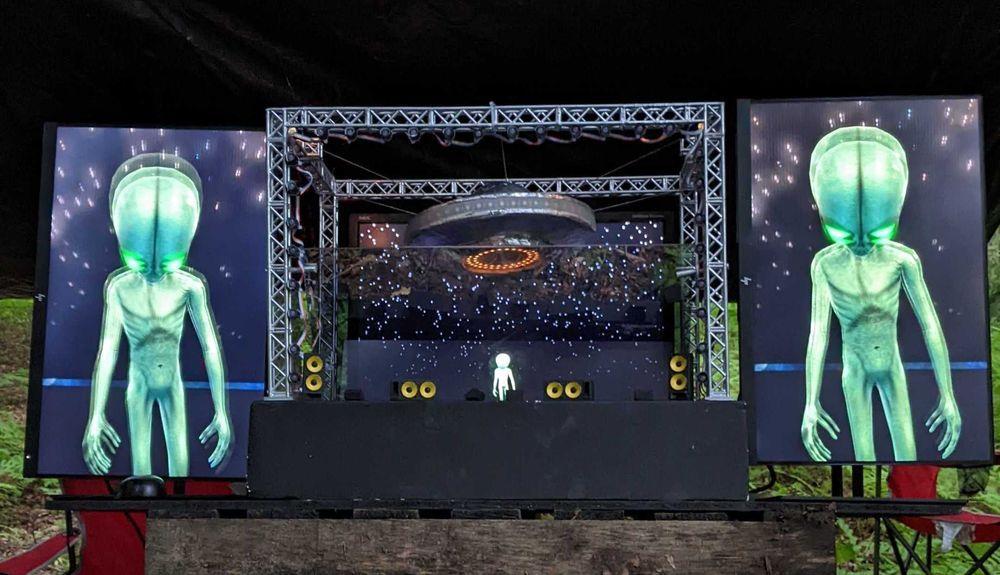 Daytime picture of the final version of the miniature stage. The stage is made with a 3D printed truss frame, a handmade UFO (cardboard & masking tape), Pepper's ghost to create a hologram for Lil Cosmos, custom VFX & lighting (TouchDesigner), and an original music album with 9 songs.